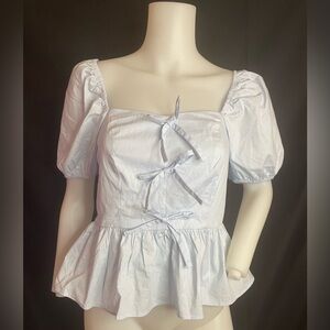 Francesca's sky blue ruffle shirt three bows down the front puffy sleeves.sz sm